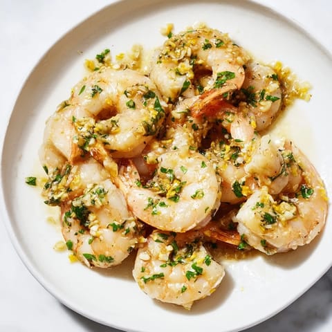 Golden garlic glistening on a plate of 15-Minute Garlic Shrimp Scampi, ready to savor.
