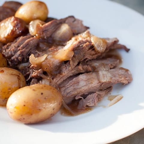 This simple 4-ingredient slow cooker pot roast features a hearty beef chuck roast and tender vegetables.