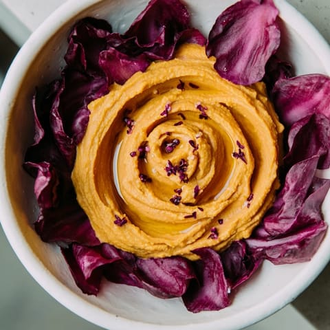 Gorgeous The Velvet Rose appetizer, with vibrant red beet hummus atop crisp radicchio for dipping.