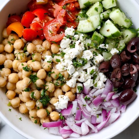 Fresh, colorful Mediterranean Chickpea and Feta Bowl, showcasing bright vegetables and creamy vegan feta.