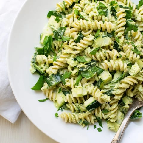 Green Goddess Pasta Salad tossed with tender fusilli, vibrant spinach, and a zesty lemon-yogurt dressing for a light lunch.