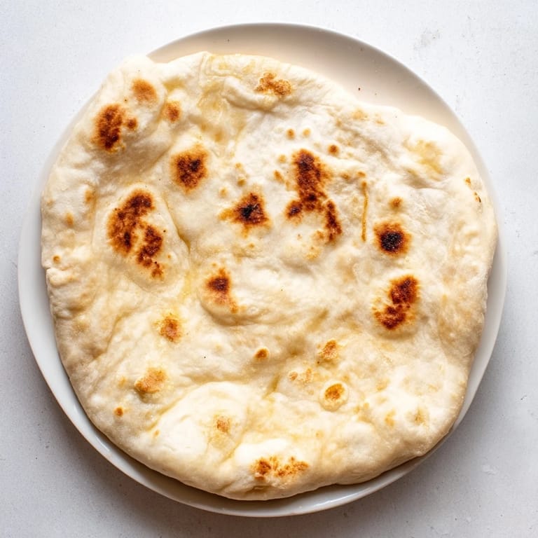 Perfectly puffed Three-Ingredient Easy Flatbreads reveal air pockets, cooked to a satisfying texture.