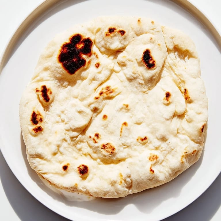 Stack of warm Three-Ingredient Easy Flatbreads promising a delicious Mediterranean-inspired meal.