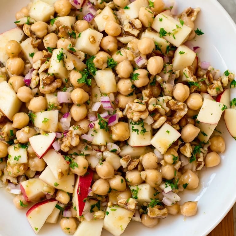 Sweet and savory Fall Harvest Apple and Chickpea Salad, showcasing vibrant produce for a satisfying vegetarian lunch option.