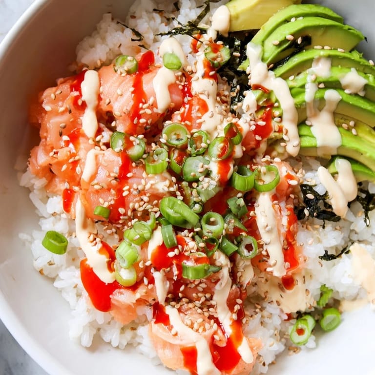 This comforting recipe of Classic Salmon Rice features salmon, rice, and fresh garnishes for a fast meal.